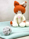 crochet cat getting yarn