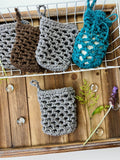 crochet soap savers on wood background